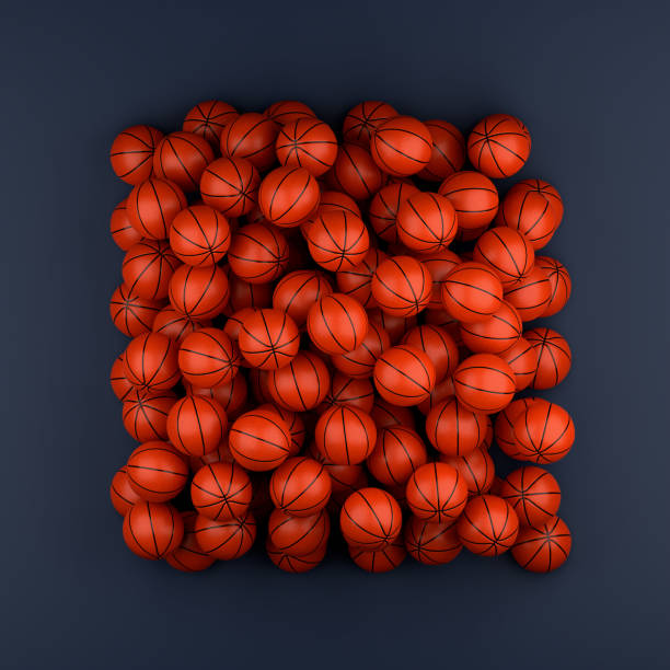 istock High angle of many basketballs on a blue background 1502221555