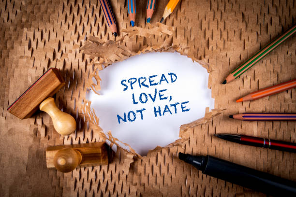istock Spread love, not hate. Torn cardboard paper and office supplies 1502223735
