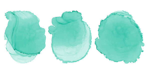 Watercolor abstract turquoise ink circle stains or paint drops or design elements.