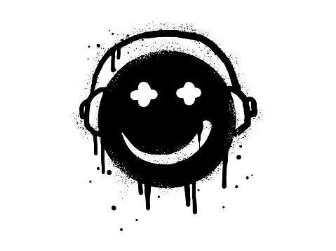 Smiling face emoticon character with headphone. Spray painted graffiti smile face in black over white. isolated on white background. vector illustration