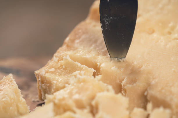 istock pieces of hard parmesan cheese on olive board from above 1502226772
