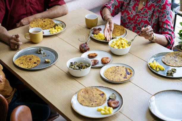 istock Senior woman serving Indian cuisine 1502237538