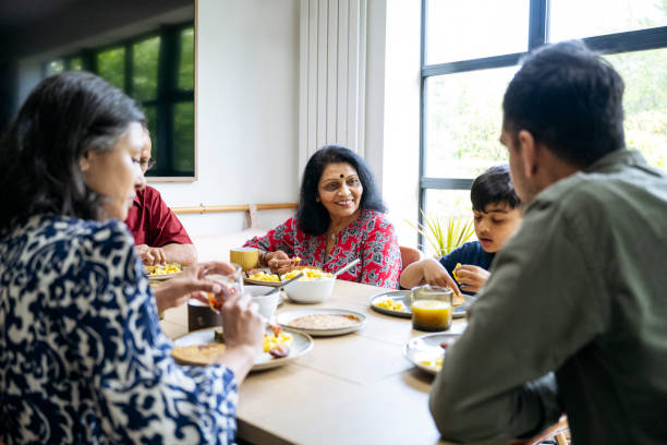 istock Multi-generation Indian family eating together 1502237566