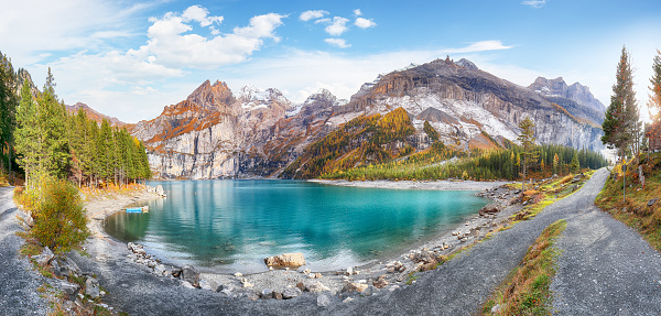 Fabulous autumn view of Oeschinensee Lake. Scene of Swiss Alps with Bluemlisalp summit on background. Location: Oeschinen valley, Canton of Bern, Switzerland, Europe