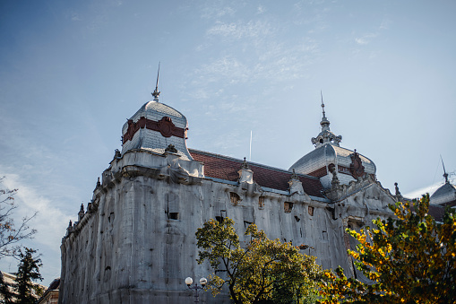 The new town hall with two landmark Art Nouveau buildings in the background, the old town hall and the Cultural Palace, in downtown Targu Mures, Romania.