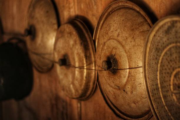 old pot lids lined the wooden kitchen walls