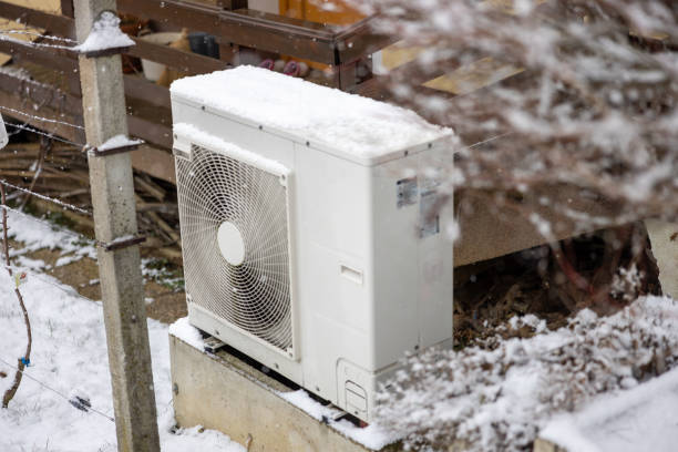 istock Heat pump outdoors on snowy landscape 1502262110