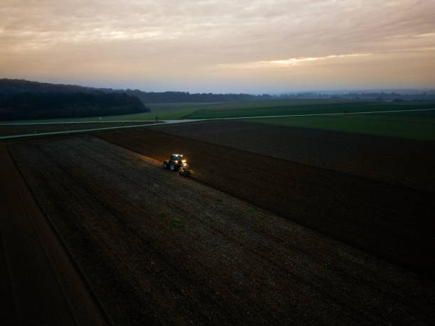 istock Tractor preparing land for sowing with cultivator 1502266006
