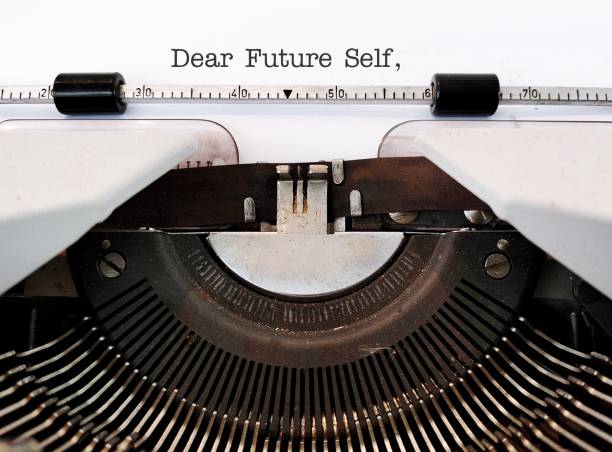 istock Vintage typewriter with type text DEAR FUTURE SELF, a letter to convey message to future you. specific goals to achieve, follow up on bucket list items or declare important affirmation 1502266036