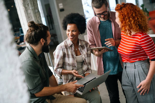 istock Team of young creative marketing experts brainstorming during work 1502289130