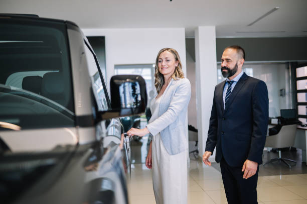 istock looking for the new SUV in the showroom 1502291454
