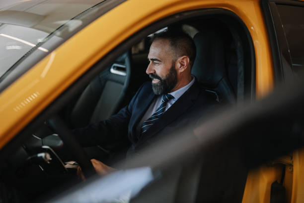 istock mid aged man shopping for a new car 1502304205