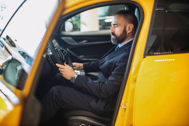 istock mid aged man shopping for a new car 1502304345