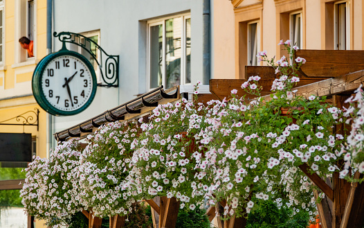 02 08 2022: Street clock on wall of house. Jelenia Gora, Poland