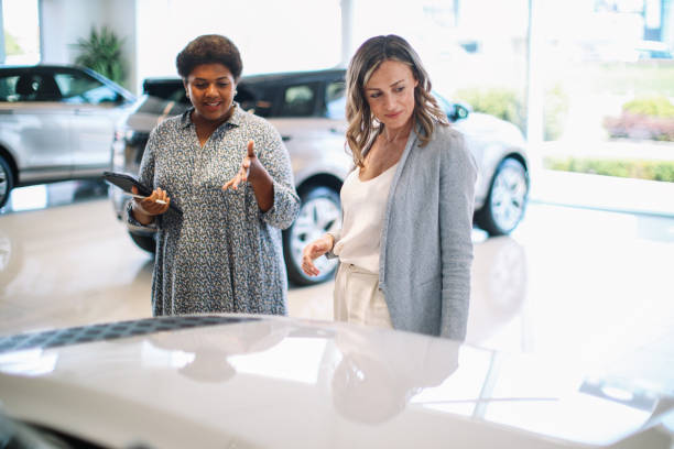 istock woman looking for a new car 1502306498