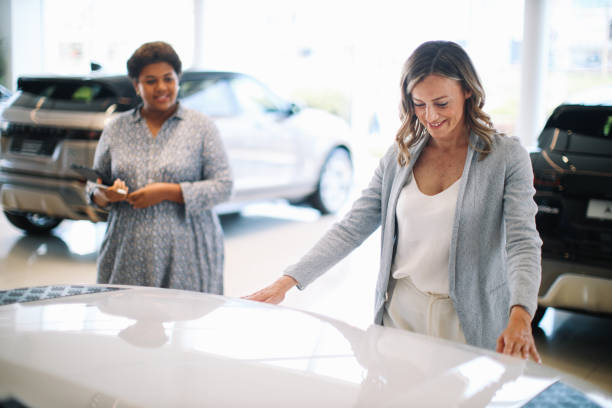 istock woman looking for a new car 1502307464