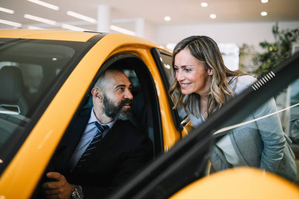 istock looking for the new SUV in the showroom 1502308256
