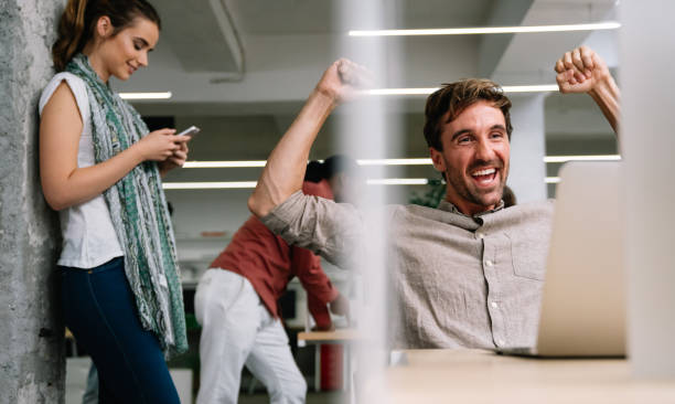 istock Smiling diverse colleagues gather in boardroom brainstorm discuss financial statistics together 1502311227