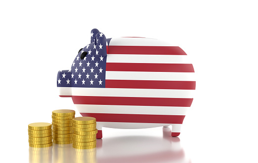 Piggy Bank Textured with American Flag and Coins isolated on White Background. Finance and investment concept.