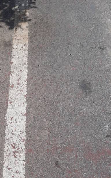 istock Asphalt highway with road markings background 1502312977