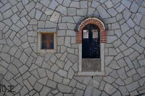 Doors and windows of stone buildings by the seaside