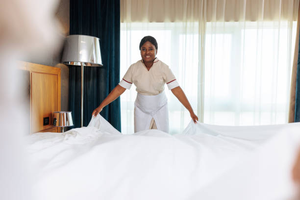 istock African-American maid holding clean sheets 1502313881