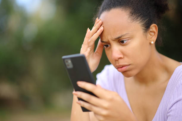 istock Worried black woman checking cell phone 1502314505