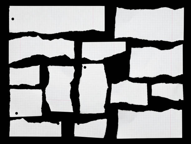 istock White ripped pieces of graph paper on black 1502314794