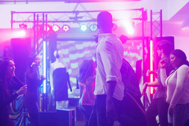 istock People dancing and partying in club 1502315225