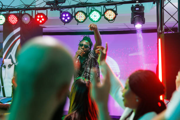 istock Musician rapping on stage in nightclub 1502315831