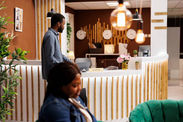 istock Man waiting for receptionist in hotel 1502316993