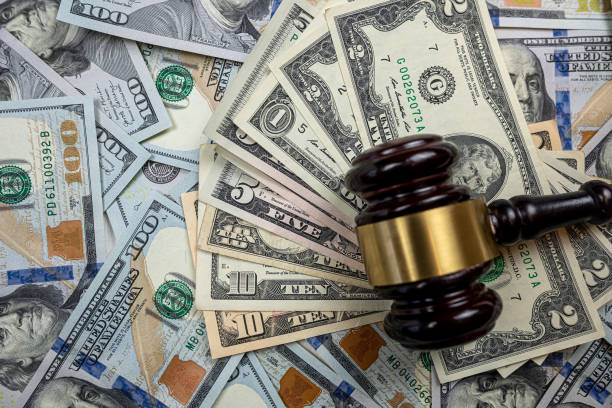 istock judge gavel and 100 dollar bills as background 1502319240