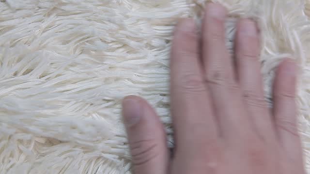 video of hand white wool plaid background