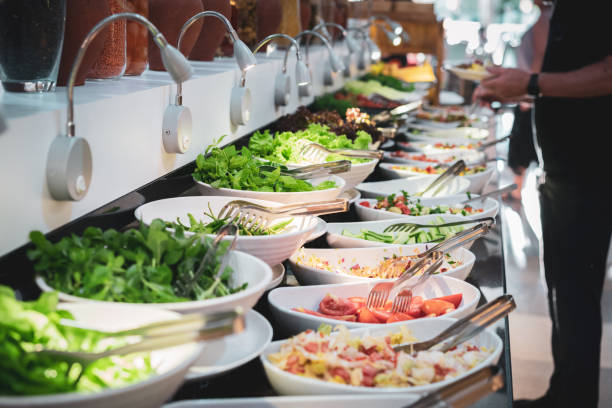 istock People getting food and salad off a buffet line 1502322946