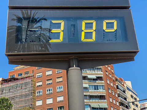 Low angle view of billboard showing 38 degrees celsius of temperature in the city of Valencia, Spain