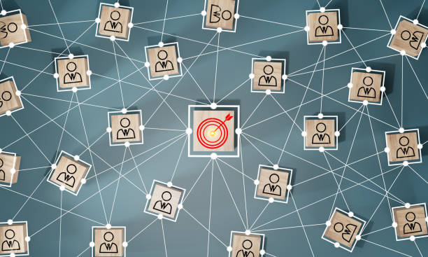 istock Red dartboard and red arrow connection linkage with human icon for customer focus target group and customer relation management concept. 1502346754