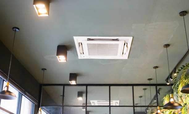 istock Modern ceiling mounted cassette type air conditioning system in coffee shop 1502348427