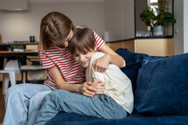 istock Happy loving mother hugging child son while having fun together at home 1502350202