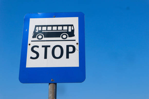 istock Bus stop sign on the bright sky 1502384438