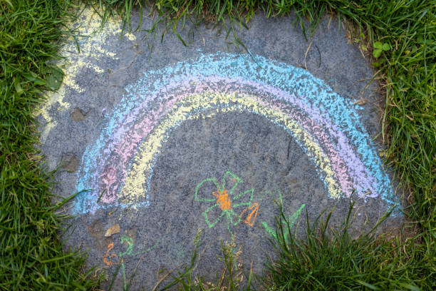 istock a rainbow painted with colored chalk on a stone 1502384661