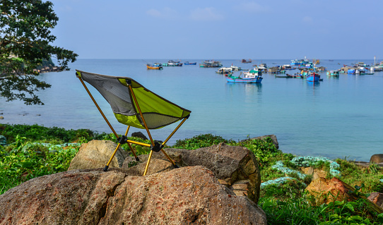 A relaxing chair with seascape background in Southern Vietnam.
