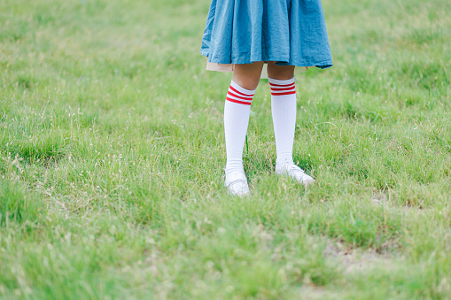 Asian Thai girls schoolgirl student wear a black leather shoes as a school uniform in isolated background, back to school concept