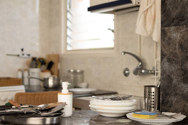 istock Tackling the Chaotic Dish Mess with Efficient Kitchen Cleaning and Hygiene.a sink empty of dirt dishware.soap and sponge 1502386012