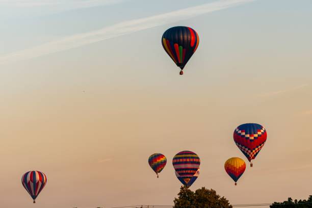 istock Sunset sky filled with colorful hot air balloons. 1502386199