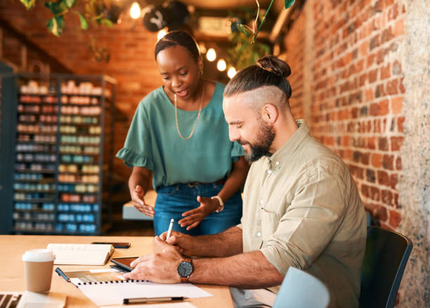 istock Tablet, coffee shop and business people for remote work, startup advice and ecommerce planning or profit goals. Coworking, digital support and diversity entrepreneur, woman and partner at cafe 1502388131