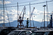 cars parked in front of an industrial port