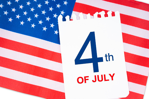 4 th July calendar with part of an American flag on white background.USA Independence Day date.
