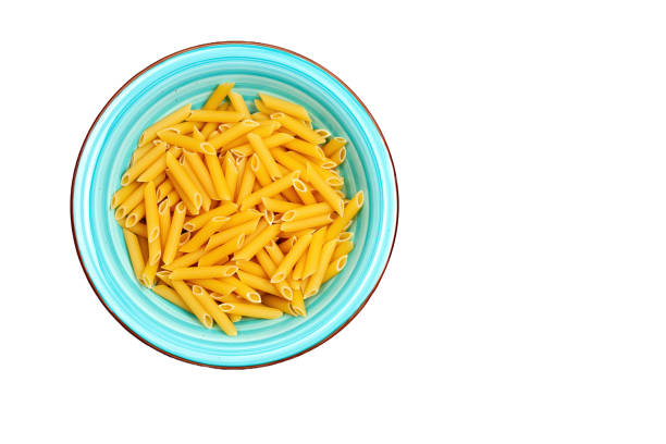 Penne pasta on a multicolored bowl with white background