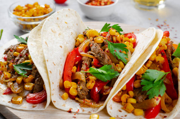 istock Mexican Tacos with Beef and Vegetables, Tacos al Pastor on Grey Background 1502417881