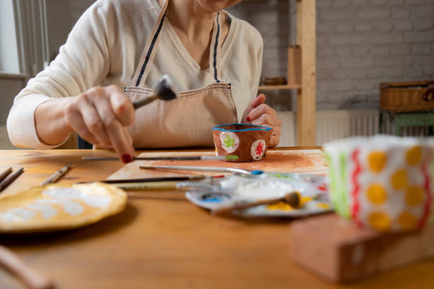 istock Woman painting a pottery 1502418611